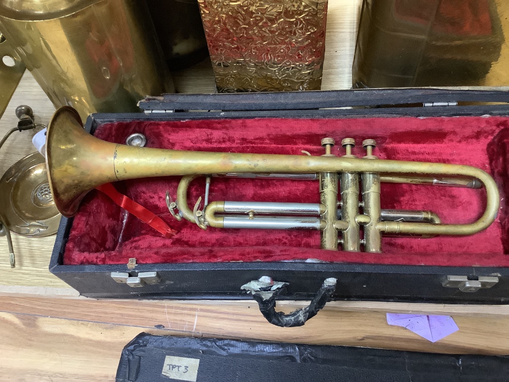 A quantity of mixed brass including a coal scuttle, trivets, a jardiniere, lighting and a trumpet, etc.